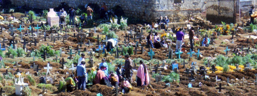 preparing graves for Dia de los Muertos in San Juan Chamula.