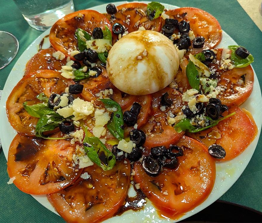 tomato salad with burrata at pizzeria la artesenal