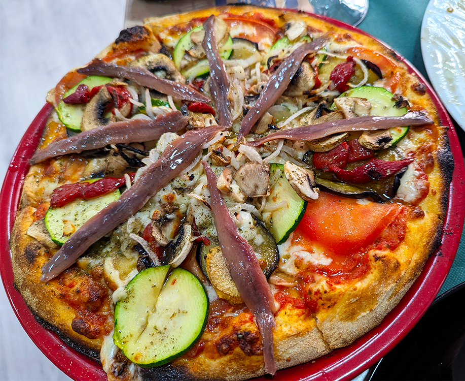 vegetable pizza with anchovies at pizzeria la artesenal