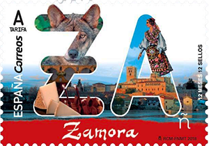 A decorative stamp from Spain featuring the word 'Zamora' with images of a wolf, traditional dancers, and a scenic view of Zamora's historic architecture.