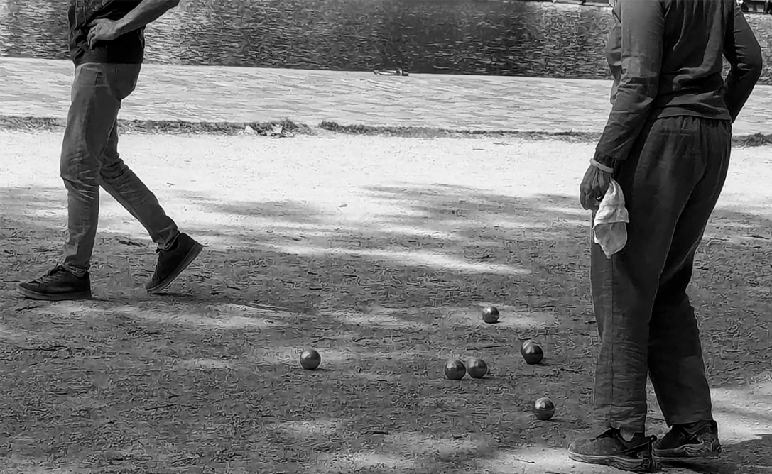 playing boule along ourcq canal in paris
