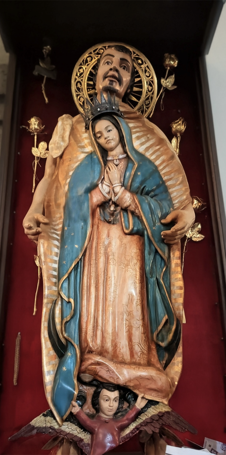 carved effigy of san juan diego cuauhtlatoatzin with virgin of guadalupe on cloak