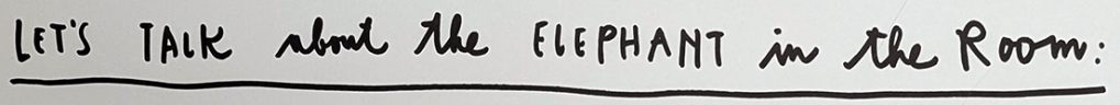 Text on a white background reading 'Let's talk about the elephant in the room:' in a handwritten style.