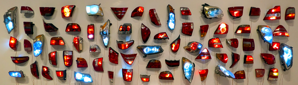 heads/tails illuminated lights intersection by madeline hollander